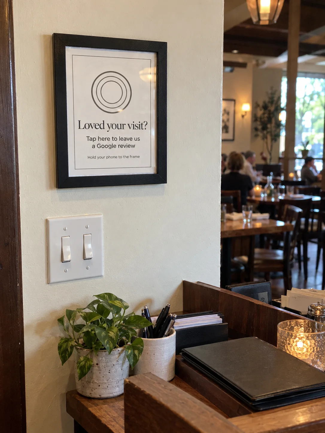 The Black 8×10 TapIt Frame hung on a wall at eye level